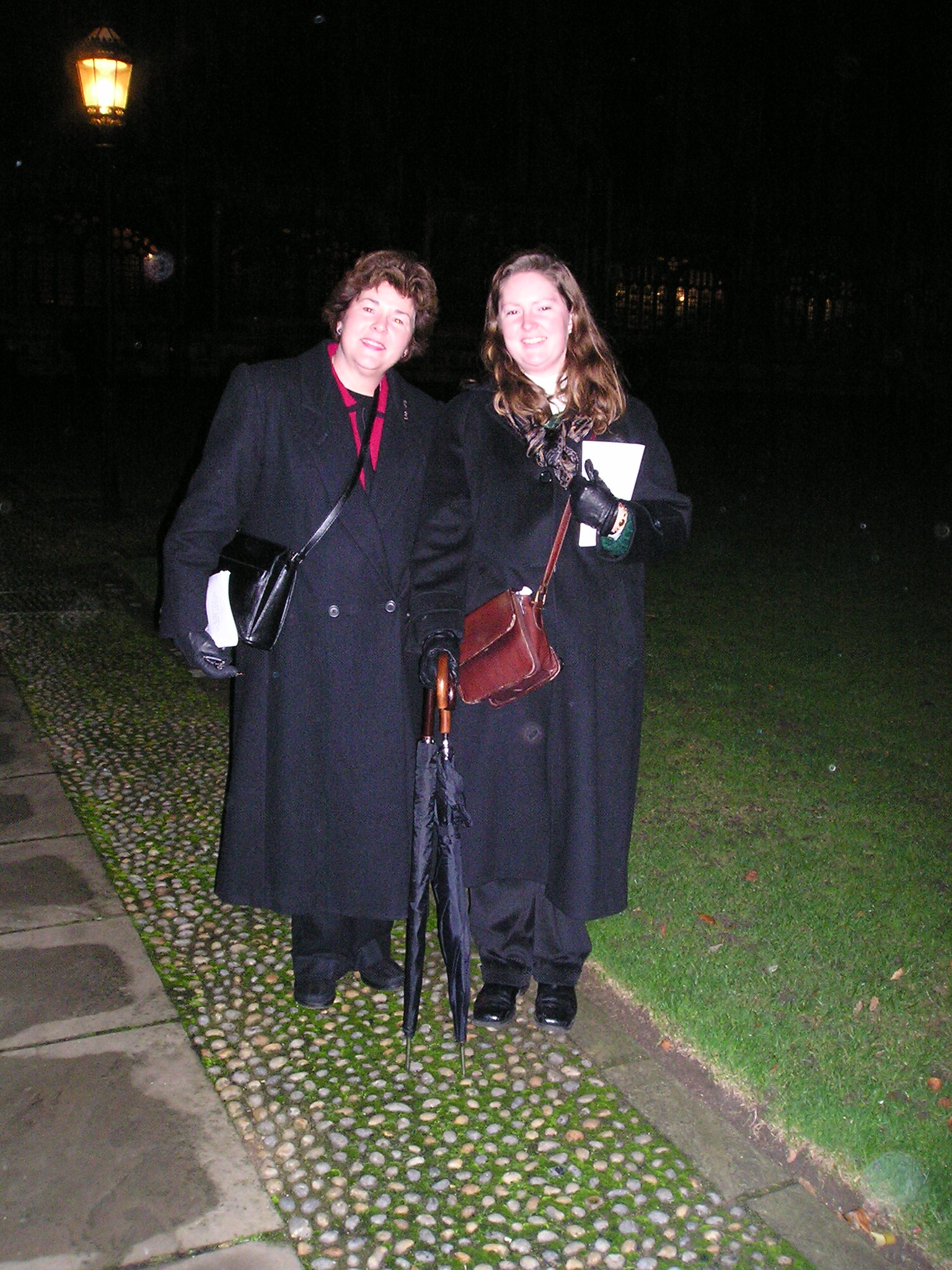 Theo and her mother in the dark at King's College after the carol service